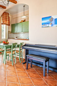 Open kitchen with piano